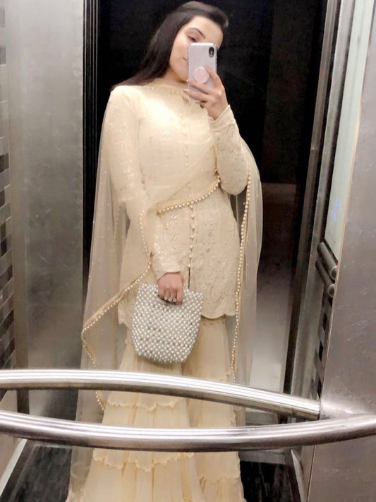 TANYA NARANG IN BEIGE CHIKANKARI FRILL SHARARA SET