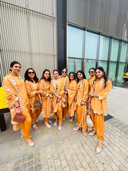 BRIDESMAIDS IN ORANGE TISSUE DHOTI SET