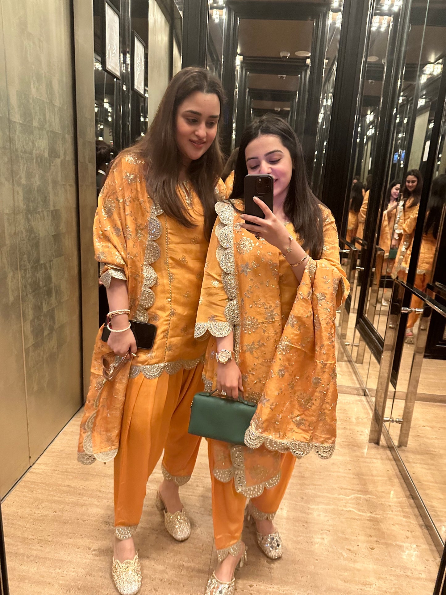 BRIDESMAIDS IN ORANGE TISSUE DHOTI SET