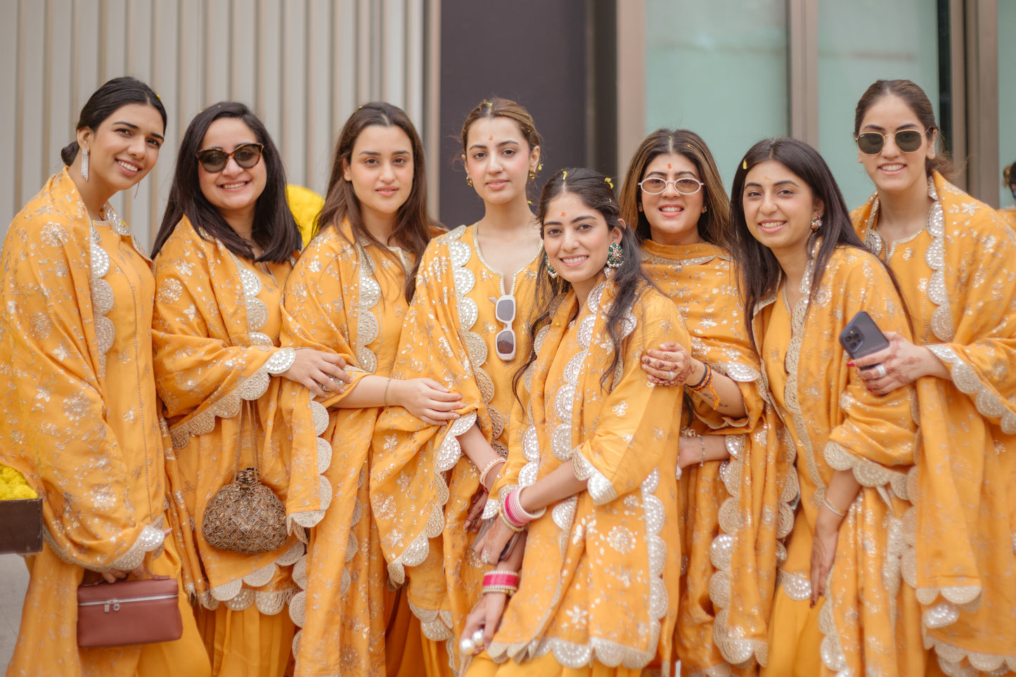 BRIDESMAIDS IN ORANGE TISSUE DHOTI SET